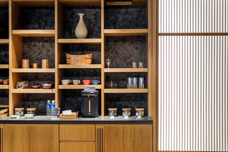 Stylish home interior featuring wooden shelves with pottery and accessories.